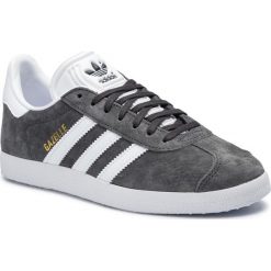 Buty adidas - Gazelle BB5480 Dgsogr/White/Goldmt. Szare buty sportowe damskie Adidas, w paski, z zamszu, z paskami. W wyprzedaży za 259,00 zł.