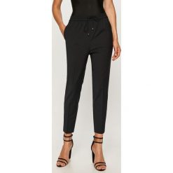 Tommy Hilfiger - Spodnie. Niebieskie spodnie damskie TOMMY HILFIGER, z aplikacjami, z elastanu. Za 649,90 zł.