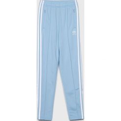 Adidas Originals - Spodnie dziecięce 140-170 cm. Niebieskie spodnie dziewczęce adidas Originals, bez wzorów, z poliesteru, sportowe. Za 179,90 zł.