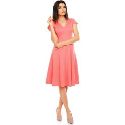 Malinowa Elegancka Rozkloszowana Sukienka z Mini Rękawkiem. Różowe sukienki balowe marki numoco, l, z dekoltem w łódkę, oversize. W wyprzedaży za 120,81 zł.