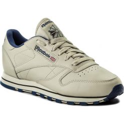 Buty Reebok - Cl Lthr 28412 Ecru/Navy. Brązowe półbuty damskie Reebok, na co dzień, bez wzorów, ze skóry, bez obcasa, bez zapięcia. Za 349,00 zł.