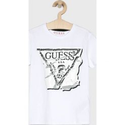 Guess Jeans - Top dziecięcy 118-175 cm. Czerwone bluzki dziewczęce Guess Jeans, z nadrukiem, z bawełny, z okrągłym kołnierzem, z krótkim rękawem, krótkie, bez kaptura. W wyprzedaży za 59,90 zł.