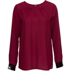 Bluzka zakładana przez głowę bonprix ciemnoczerwony. Fioletowe bluzki damskie bonprix, bez wzorów, eleganckie, bez kołnierzyka, bez rękawów. Za 64,99 zł.