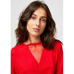 Bluzka koszulowa z łączonych materiałów. Bluzki damskie Moodo, xs, z materiału. Za 29,99 zł.