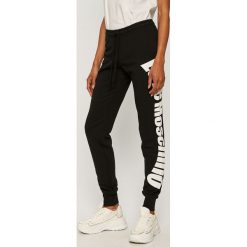 Love Moschino - Spodnie. Czarne spodnie damskie Love Moschino, m, z nadrukiem, z elastanu. Za 829,90 zł.