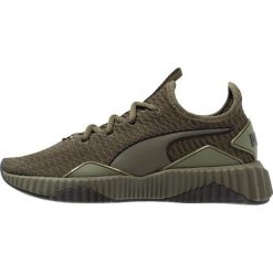Puma DEFY Obuwie treningowe forest night/black. Brązowe buty sportowe damskie Puma, z materiału. Za 419,00 zł.