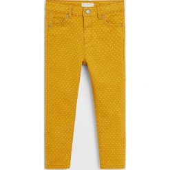 Mango Kids - Spodnie dziecięce 80-104 cm. Żółte spodnie dziewczęce Mango Kids, bez wzorów, z elastanu. Za 69,90 zł.
