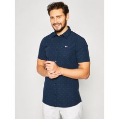 Koszula Tommy Jeans Dobby DM0DM08127. Białe koszule męskie Tommy Jeans, xxl, bez wzorów, z bawełny, casualowe, bez kołnierzyka, bez rękawów. W wyprzedaży za 199,00 zł.