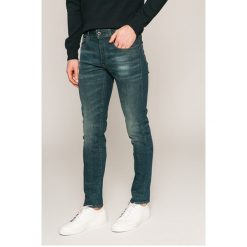 G-Star Raw - Jeansy 3301. Niebieskie jeansy męskie marki G-Star RAW, z aplikacjami, retro. W wyprzedaży za 379,90 zł.
