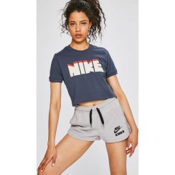 Nike Sportswear - Top. Białe topy damskie marki Nike Sportswear, s, z nadrukiem, z elastanu, z okrągłym kołnierzem. W wyprzedaży za 99,90 zł.
