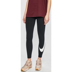 Nike - Legginsy. Czarne spodnie damskie Nike, m, z bawełny. Za 169,90 zł.