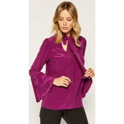 Bluzka MICHAEL Michael Kors Adult MF84LLL96K. Fioletowe bluzki damskie MICHAEL Michael Kors, l, bez wzorów, z jedwabiu, bez kołnierzyka, bez rękawów. W wyprzedaży za 419,00 zł.