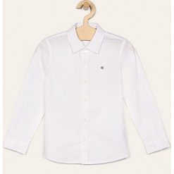 Calvin Klein Jeans - Koszula dziecięca 104-176 cm. Białe koszule chłopięce Calvin Klein Jeans, bez wzorów, z elastanu, eleganckie, bez kołnierzyka, z długim rękawem, długie. Za 269,90 zł.