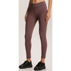Brązowe Legginsy Fyrelvia. Pomarańczowe legginsy damskie Renee, s, bez wzorów. Za 69,99 zł.