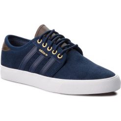 Buty adidas - Seeley B27785 Conavy/Umber/Ftwwht. Niebieskie buty sportowe damskie Adidas, bez wzorów, z zamszu, sportowe. W wyprzedaży za 209,00 zł.