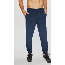 Calvin Klein Performance - Spodnie. Niebieskie spodnie męskie marki Calvin Klein Performance, s, bez wzorów, z elastanu, sportowe. Za 269,90 zł.