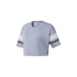 Bluzki Reebok Sport Koszulka Meet You There Colorblock. Niebieskie bluzki sportowe damskie Reebok Sport, s, bez wzorów, bez kołnierzyka, bez rękawów, bez kaptura. Za 99,95 zł.