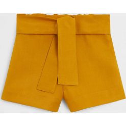 Mango Kids - Szorty dziecięce Line 80-104 cm. Żółte spodenki dziewczęce Mango Kids, bez wzorów, z lyocellu, casualowe. Za 69,90 zł.