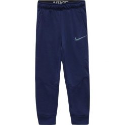 Chinosy chłopięce: Nike Spodnie juniorskie NK Dry Pant Taper FLC niebieskie 152 cm (856168 429)