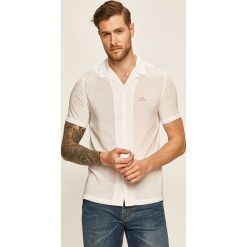 Armani Exchange - Koszula. Czarne koszule męskie Armani Exchange, s, bez wzorów, z tkaniny, klasyczne, z klasycznym kołnierzykiem, z krótkim rękawem. Za 349,90 zł.
