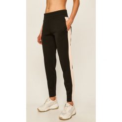 Dkny - Legginsy. Czarne spodnie damskie DKNY, s, z bawełny. W wyprzedaży za 249,90 zł.