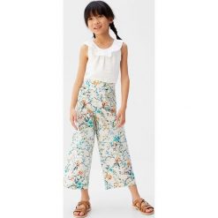 Mango Kids - Top dziecięcy Geranio 110-164 cm. Bluzki dziewczęce Mango Kids, bez wzorów, z bawełny, z okrągłym kołnierzem, bez rękawów, bez kaptura. Za 69,90 zł.