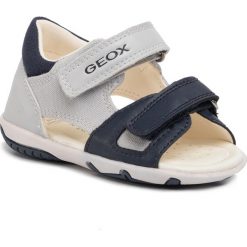 Sandały GEOX - B S.Elba B. B B02L8B 01054 C1297 Lt Grey/Navy. Szare sandały chłopięce Geox, ze skóry ekologicznej, bez zapięcia. W wyprzedaży za 149,00 zł.