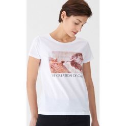 Koszulka z nadrukiem Creation of cat - Biały. Białe koszulki damskie House, xl, z nadrukiem, bez kołnierzyka, bez rękawów. Za 29,99 zł.