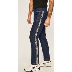 Roberto Cavalli Sport - Spodnie. Niebieskie spodnie męskie Roberto Cavalli Sport, na co dzień, xl, bez wzorów, z elastanu, sportowe. W wyprzedaży za 999,90 zł.