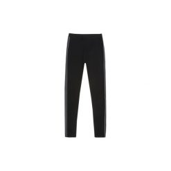 Legginsy damskie długie z lampasami. Czarne legginsy TXM. Za 24,99 zł.
