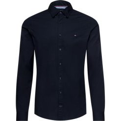 Koszula TOMMY HILFIGER Core 867894704. Niebieskie koszule męskie TOMMY HILFIGER, m, bez wzorów, z elastanu, casualowe, bez kołnierzyka, bez rękawów. W wyprzedaży za 209,00 zł.