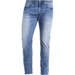 Cristiano Ronaldo CR7 Jeansy Slim Fit coastal blue. Niebieskie jeansy męskie relaxed fit marki Cristiano Ronaldo CR7. W wyprzedaży za 314,25 zł.