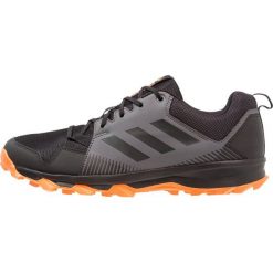 Adidas Performance TERREX TRACEROCKER Obuwie hikingowe core black/carbon/hires orange. Czarne buty sportowe męskie marki adidas Performance, z tworzywa sztucznego, bez zapięcia, outdoorowe. Za 379,00 zł.
