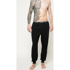 Calvin Klein Underwear - Spodnie piżamowe. Czarne piżamy męskie Calvin Klein Underwear, na co dzień, xl, bez wzorów, z elastanu. W wyprzedaży za 99,90 zł.