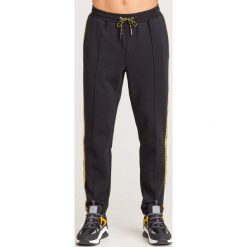 SPODNIE DRESOWE Armani Exchange. Czarne spodnie męskie m, z tkaniny. Za 335,40 zł.