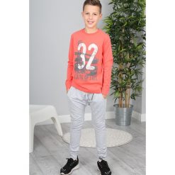 Koralowa Bluzka NDZ7607. Pomarańczowe t-shirty chłopięce marki Fasardi, bez wzorów, bez rękawów. Za 29,00 zł.
