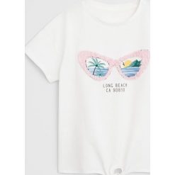 Mango Kids - T-shirt dziecięcy Beach 110-164 cm. Różowe bluzki dziewczęce Mango Kids, z aplikacjami, z bawełny, z okrągłym kołnierzem, z krótkim rękawem, krótkie, bez kaptura. Za 45,90 zł.