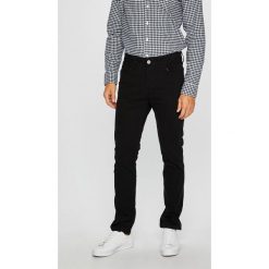 Jack & Jones - Spodnie. Czarne spodnie męskie Jack & Jones, na co dzień, bez wzorów, z elastanu, casualowe. W wyprzedaży za 89,90 zł.