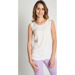 Bluzka ecru bez rękawów BIALCON. Czarne bluzki damskie marki BIALCON, uniwersalny, z aplikacjami, eleganckie, z klasycznym kołnierzykiem, bez rękawów. W wyprzedaży za 105,00 zł.