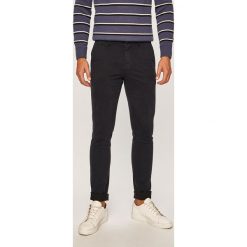 Tommy Hilfiger - Spodnie. Czarne spodnie męskie TOMMY HILFIGER, na co dzień, bez wzorów, z elastanu, casualowe. W wyprzedaży za 329,90 zł.