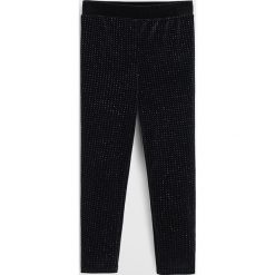 Mango Kids - Legginsy dziecięce Glit 110-164 cm. Czarne spodnie dziewczęce Mango Kids, bez wzorów, z elastanu. W wyprzedaży za 49,90 zł.