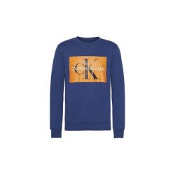 Bluzy Calvin Klein Jeans J30J307746 MONOGRAM BOX LOGO. Niebieskie bluzy męskie Calvin Klein Jeans, xl, bez wzorów, z jeansu, bez kołnierzyka, bez rękawów, bez kaptura. Za 305,10 zł.