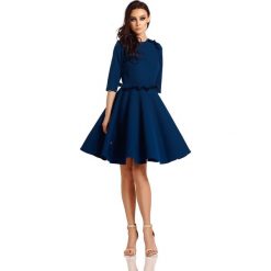 Kobieca sukienka z falbankami L291 granatowy granatowy. Niebieskie sukienki dziewczęce Tagless, bez wzorów, eleganckie, bez rękawów, rozkloszowane. Za 159,90 zł.
