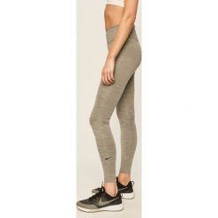 Nike - Legginsy. Szare spodnie damskie Nike, s, bez wzorów, z elastanu. Za 159,90 zł.