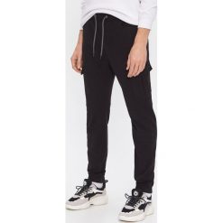 Spodnie jogger z kieszenią - Czarny. Czarne spodnie męskie House, s, bez wzorów. Za 129,99 zł.