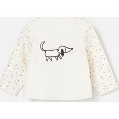 Bawełniana bluza z naszywką - Kremowy. Białe bluzy damskie Reserved, z aplikacjami, z bawełny, bez rękawów, bez kaptura. W wyprzedaży za 19,99 zł.