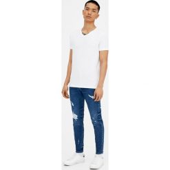 Jeansy męskie: Ciemnoniebieskie jeansy skinny fit z przetarciami