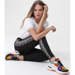 Czarne Legginsy Birigui. Czarne legginsy sportowe damskie Born2be, s, bez wzorów, z materiału, tenisowe. Za 49,99 zł.