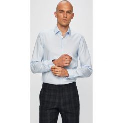 Calvin Klein - Koszula. Niebieskie koszule męskie Calvin Klein, bez wzorów, z bawełny, klasyczne, z klasycznym kołnierzykiem, z długim rękawem. W wyprzedaży za 219,90 zł.