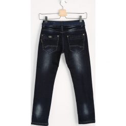 Chinosy chłopięce: Granatowe Jeansy Rubbed